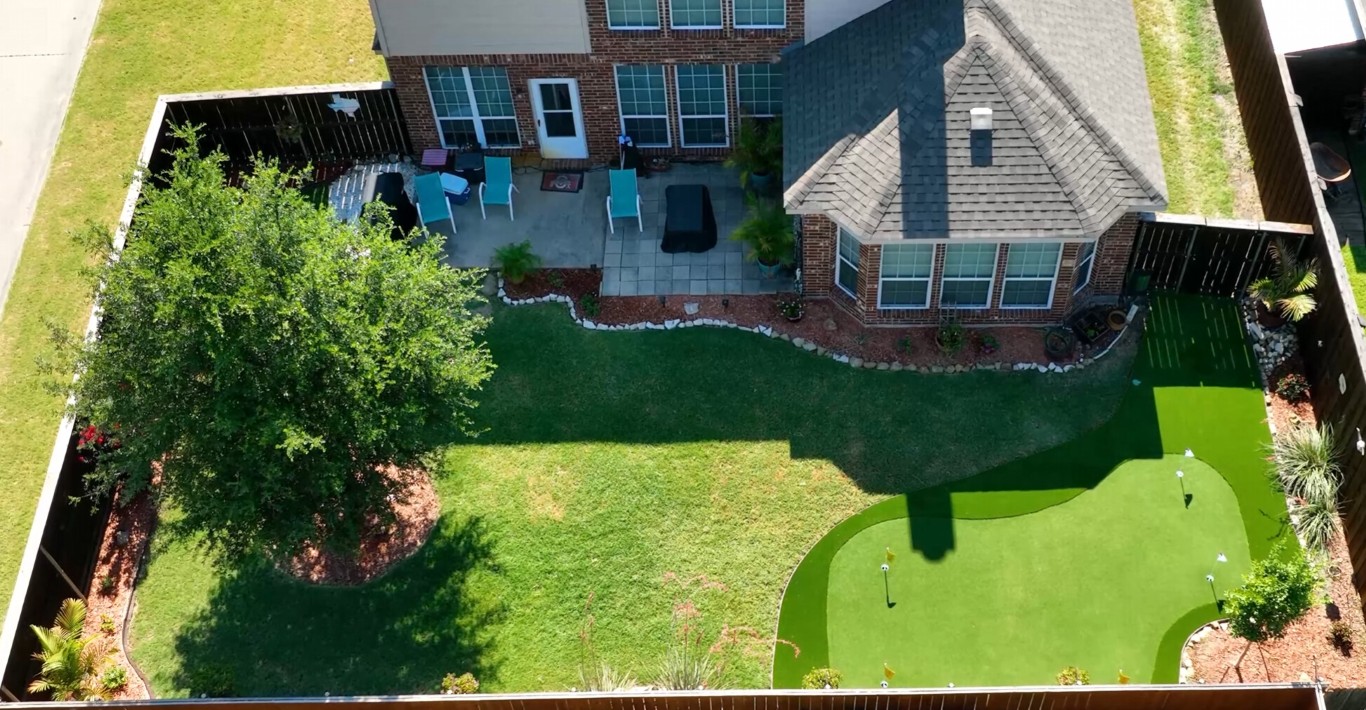 Custom backyard putting green installation aerial view